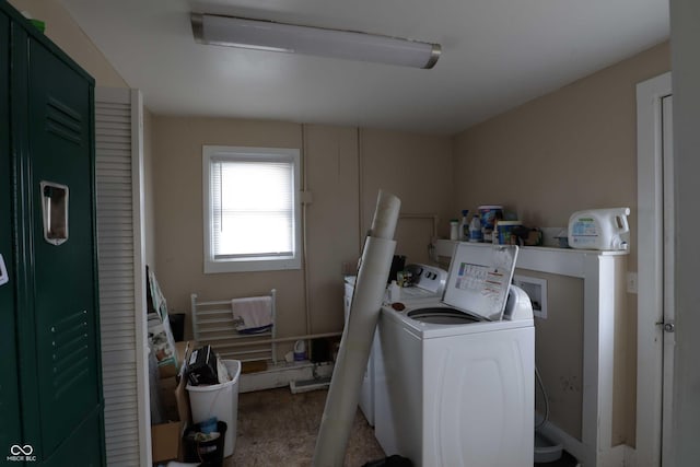 laundry room featuring separate washer and dryer and laundry area