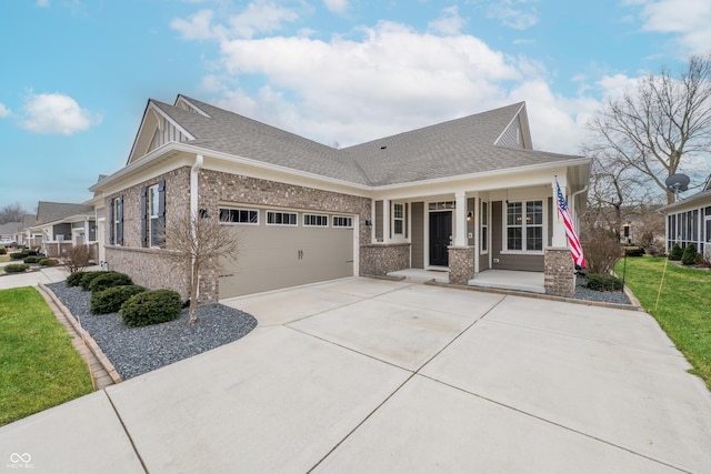 view of front of home featuring a garage and a porch