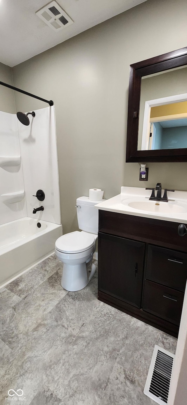 full bathroom featuring vanity, bathtub / shower combination, and toilet