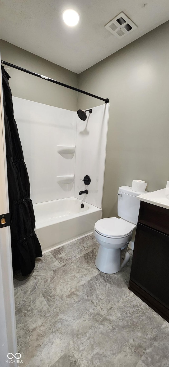 full bathroom featuring vanity, shower / washtub combination, and toilet