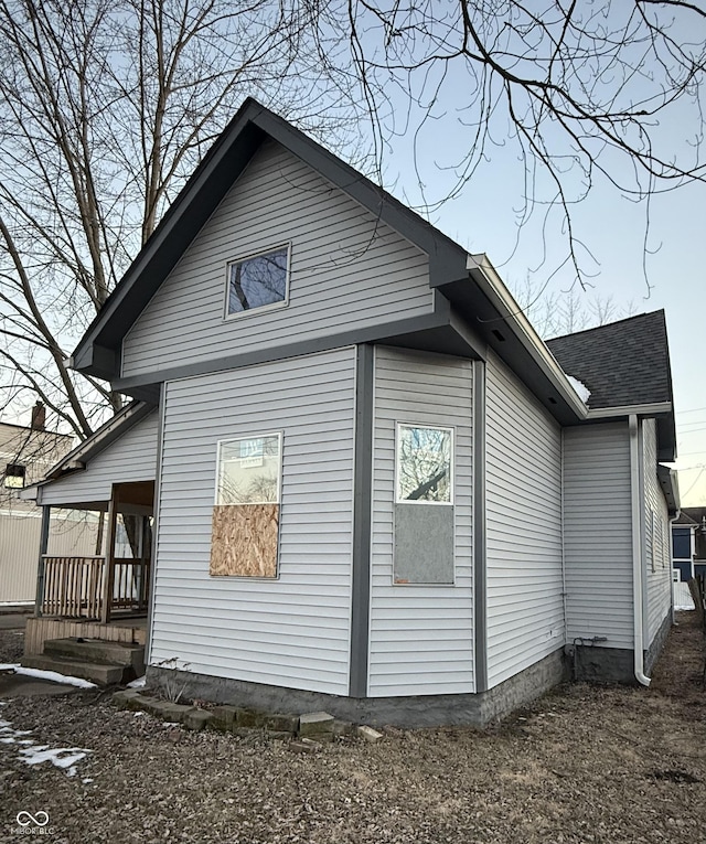 view of side of property featuring a porch