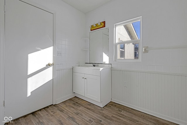 laundry room with light hardwood / wood-style flooring