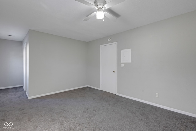 unfurnished room with ceiling fan and carpet flooring