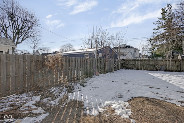 view of yard covered in snow