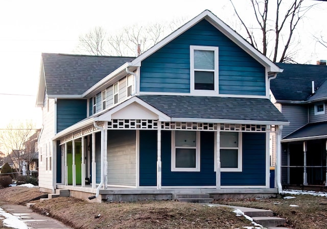 back of property with a porch