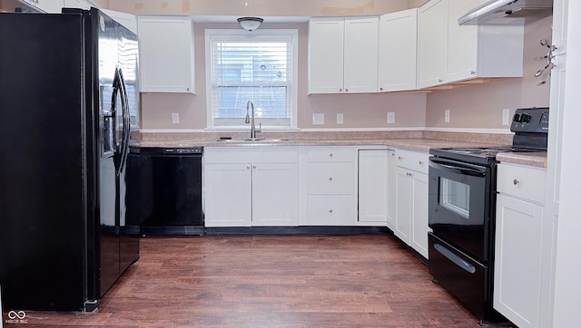 kitchen with white cabinetry, sink, dark hardwood / wood-style flooring, and black appliances