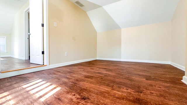 bonus room featuring lofted ceiling and hardwood / wood-style flooring