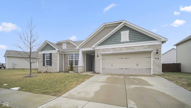 view of front of home with a garage and a front lawn