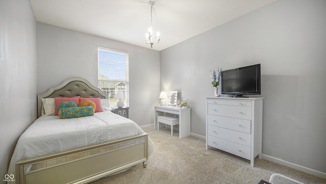 carpeted bedroom with a notable chandelier