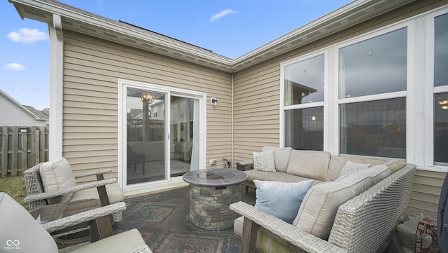 view of patio featuring an outdoor living space with a fire pit