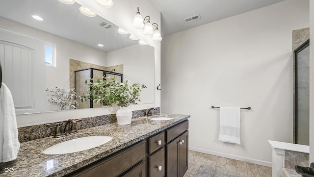 bathroom with vanity and an enclosed shower