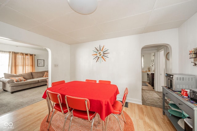 dining area with light hardwood / wood-style floors