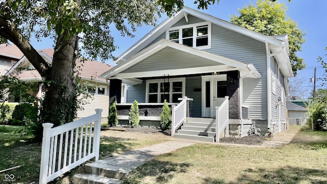 bungalow-style house featuring a front yard and a porch