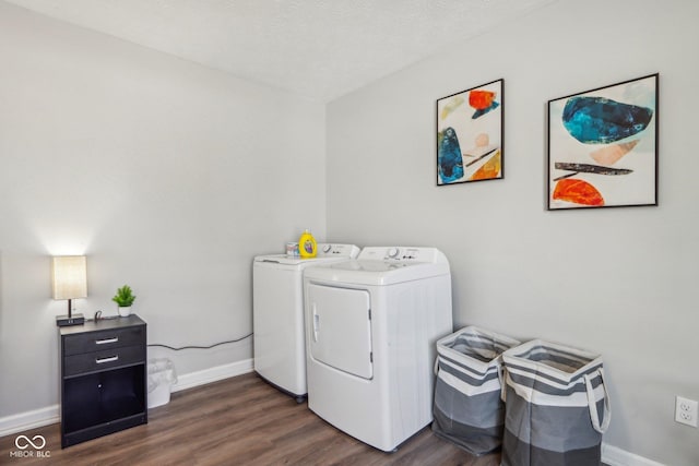 laundry room featuring dark hardwood / wood-style floors, washer and dryer, and a textured ceiling