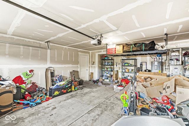 garage featuring a garage door opener and electric water heater