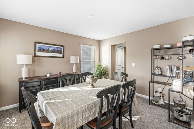 view of carpeted dining area