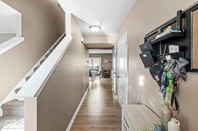 corridor with dark hardwood / wood-style floors