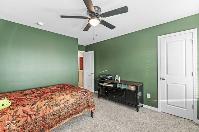 bedroom with light carpet and ceiling fan