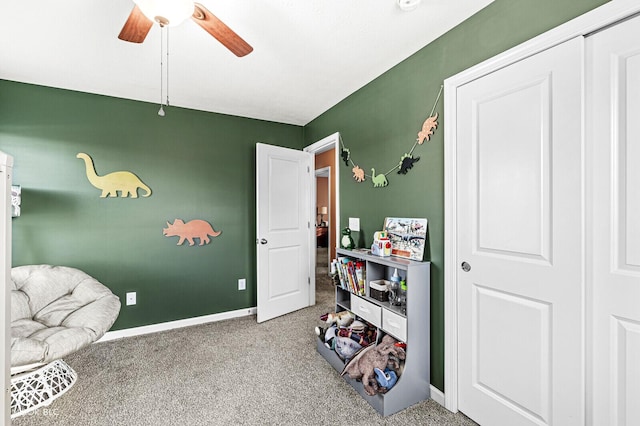 playroom featuring carpet and ceiling fan