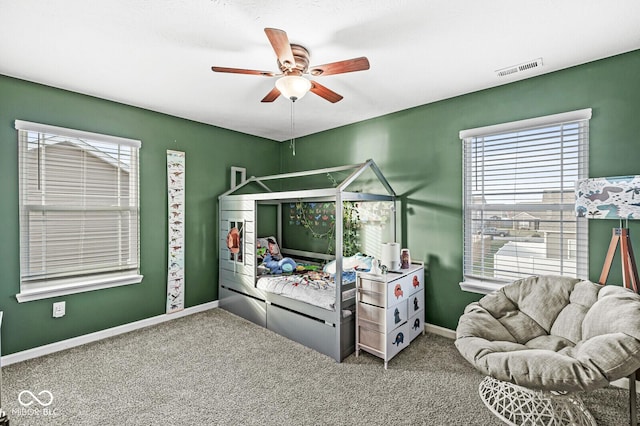 carpeted bedroom featuring ceiling fan