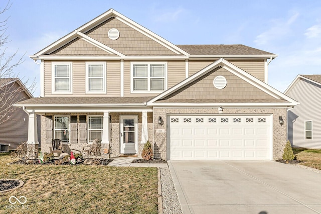 craftsman house featuring central AC, a garage, covered porch, and a front yard