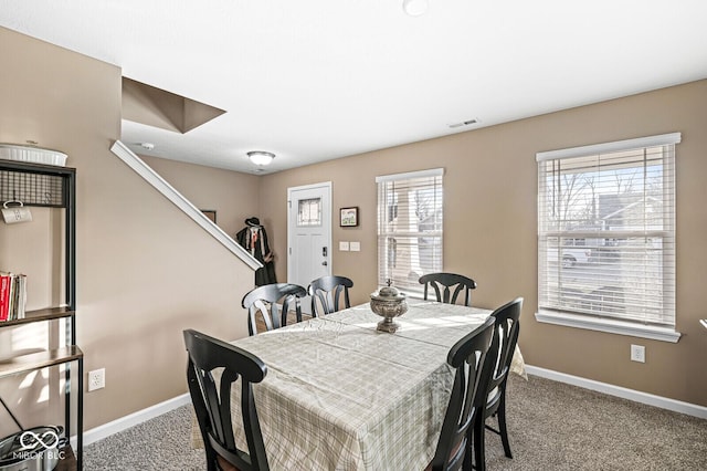 dining space with carpet and a healthy amount of sunlight