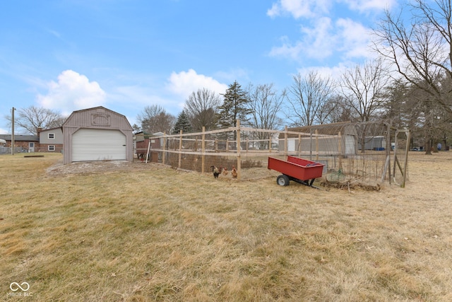 view of yard with an outbuilding and a garage