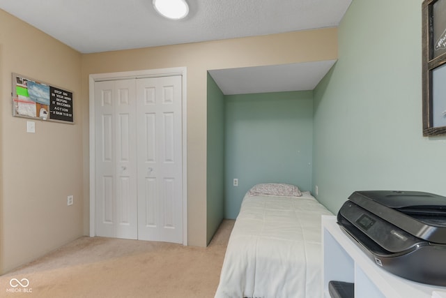 carpeted bedroom featuring a closet