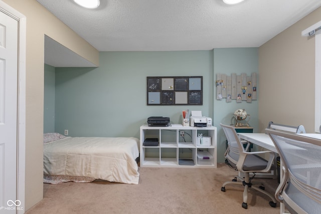 carpeted bedroom with a textured ceiling