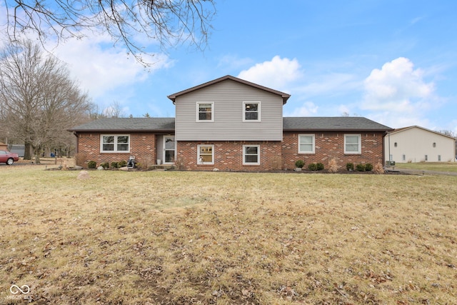 rear view of house with a yard