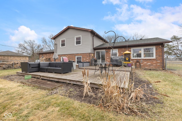 back of property with an outdoor living space, a lawn, and a wooden deck