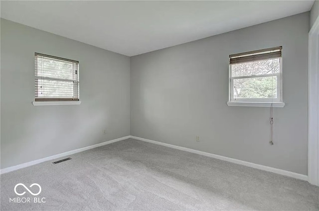 unfurnished room featuring carpet