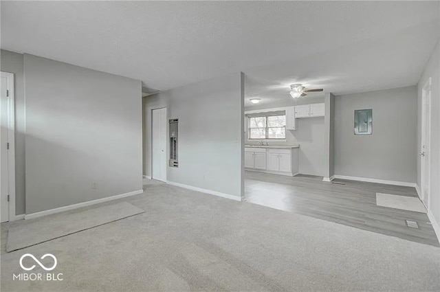 empty room with sink and electric panel