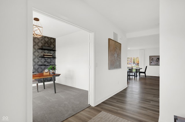 corridor with dark wood-type flooring