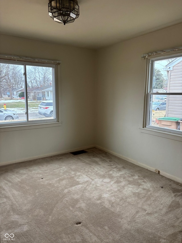 unfurnished room with carpet floors