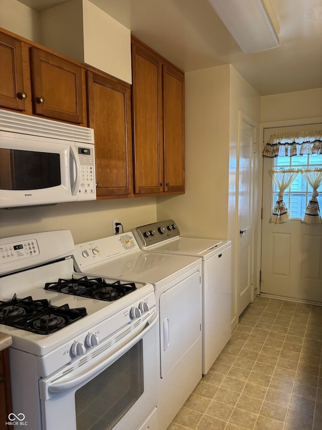 kitchen featuring separate washer and dryer and white appliances