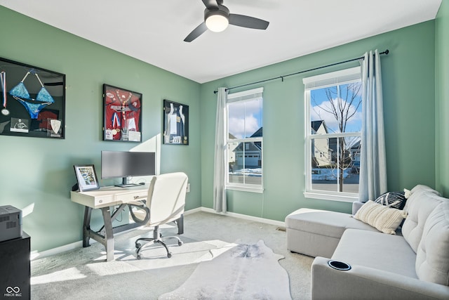 office with ceiling fan and light carpet