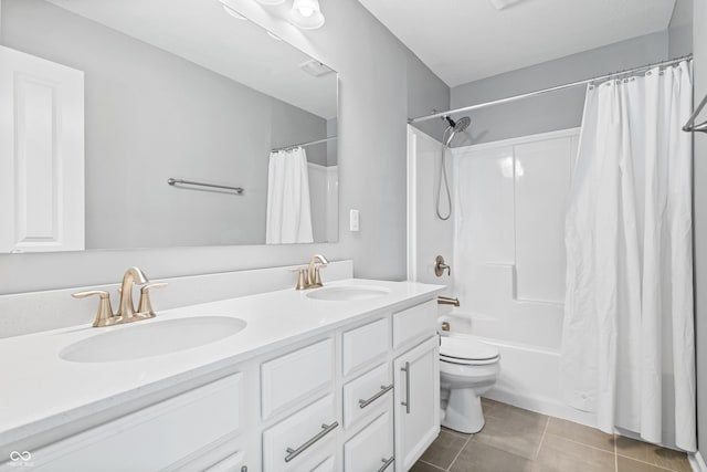 full bathroom with tile patterned flooring, vanity, toilet, and shower / bathtub combination with curtain