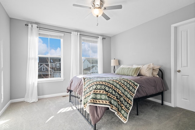 bedroom with ceiling fan and carpet