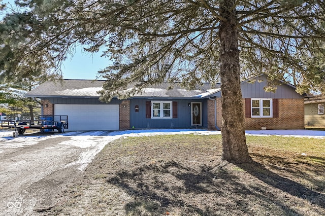 single story home featuring a garage