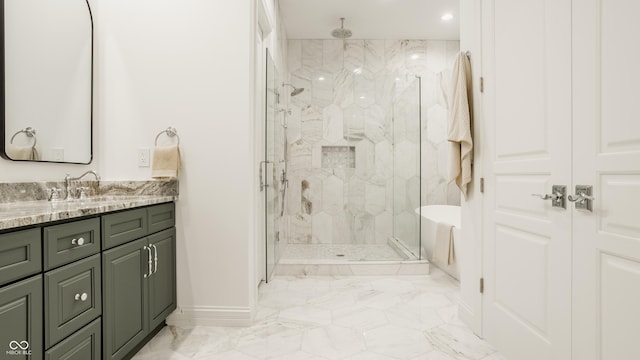 bathroom featuring vanity and shower with separate bathtub