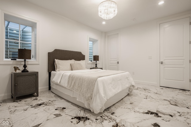 bedroom featuring an inviting chandelier