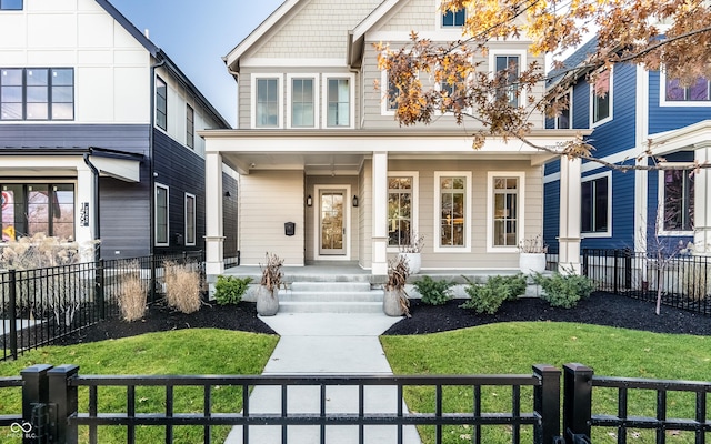 view of front of property with a porch and a front yard