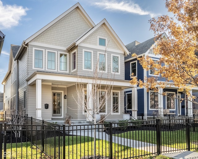 craftsman-style home with a front lawn