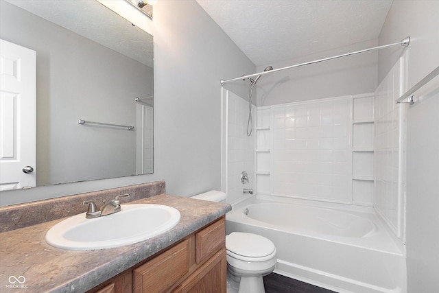 full bathroom featuring vanity, shower / bathtub combination, a textured ceiling, and toilet