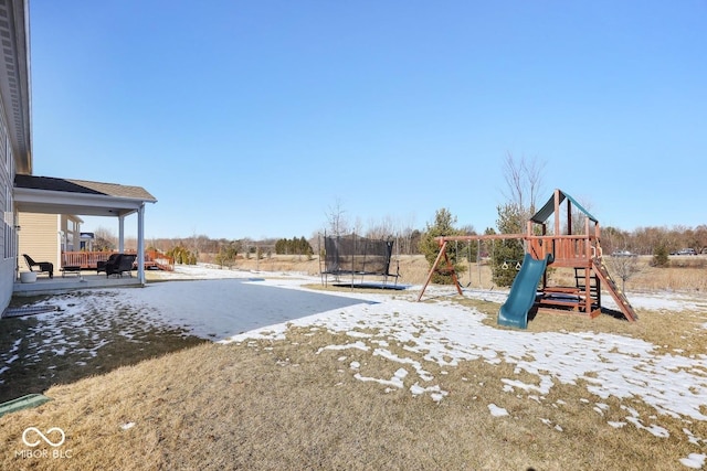 view of jungle gym with a trampoline