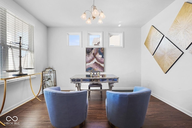 dining space featuring an inviting chandelier and dark wood-type flooring