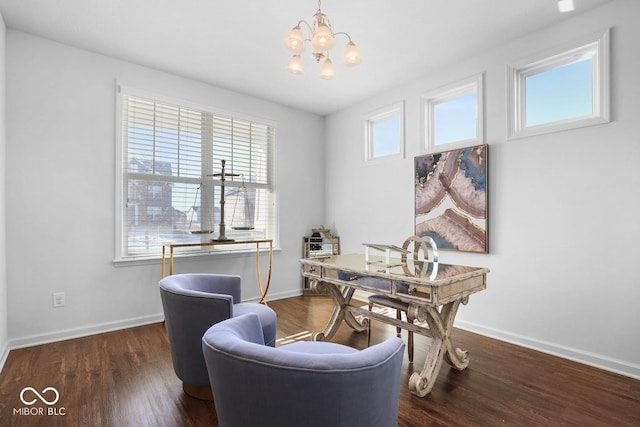 office featuring dark wood-type flooring and an inviting chandelier