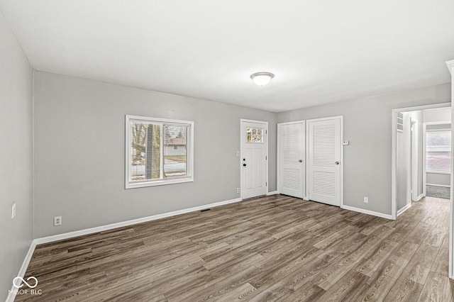 interior space with hardwood / wood-style flooring and a closet