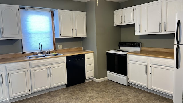 kitchen featuring sink, white cabinets, and white appliances